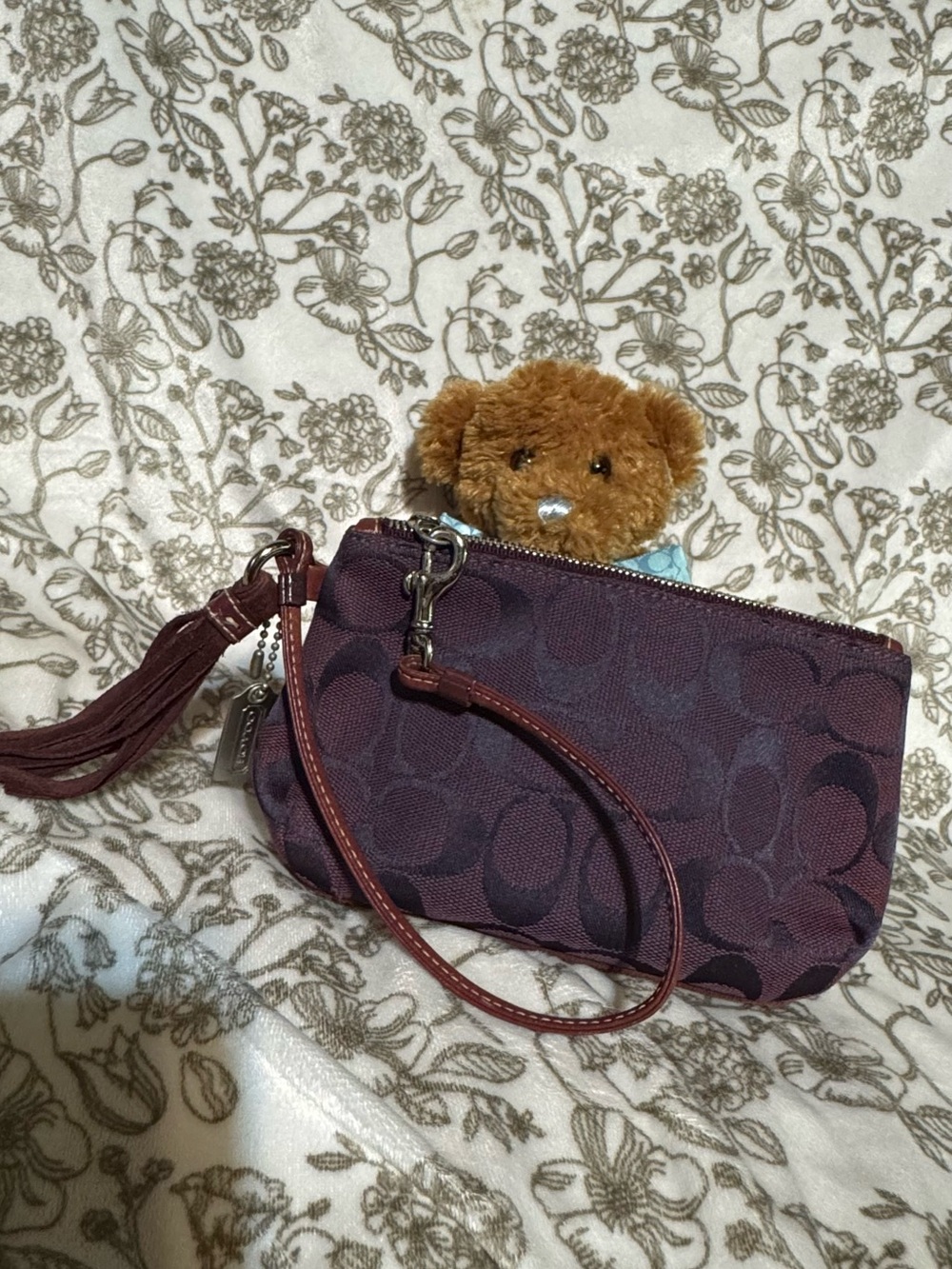 Sold on Mercari! Coach Plum Signature Canvas Wristlet with Suede Tassel